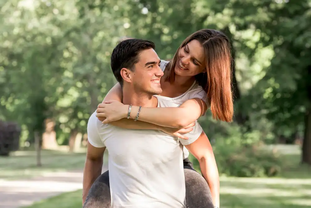 Couple spending relaxed time together outdoors, easy and comfortable with each other