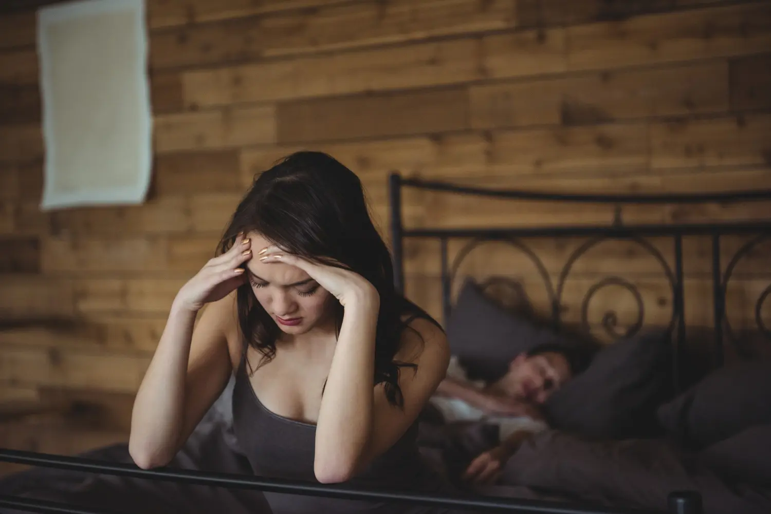 Why pornography is ruining so many relationships — couple disconnected on bed showing emotional damage